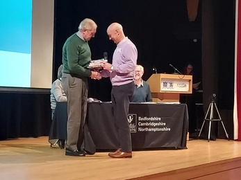 Andrew Cuthbert receiving award at AGM