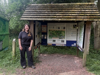 Natalie stands in front of the Great Fen information hut