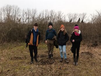 Broden with three fellow Youth Rangers, dressed against the cold in a nature reserve in winter