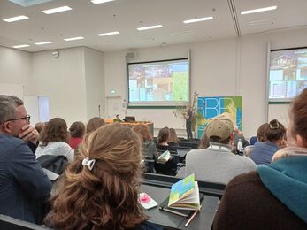 People watching a presentation in a lecture hall