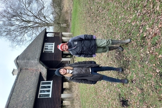 Lisa Davenport and Rebekah O'Driscoll at Woodwalton Fen standing by Rothschild's Bungalow