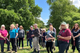 Group of adults on a hot sunny day in a nature reserve