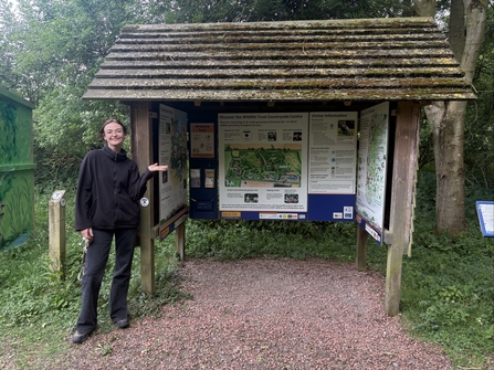 Lucy stands in front of the Great Fen information hut