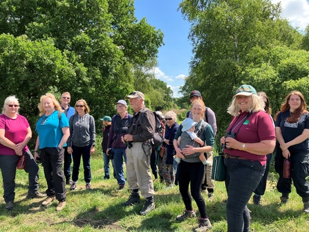 Group of adults on a hot sunny day in a nature reserve